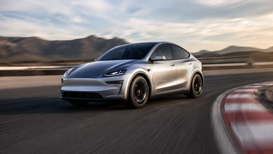 Tesla Model Y exterior on a race track showing performance capability and sleek design profile
