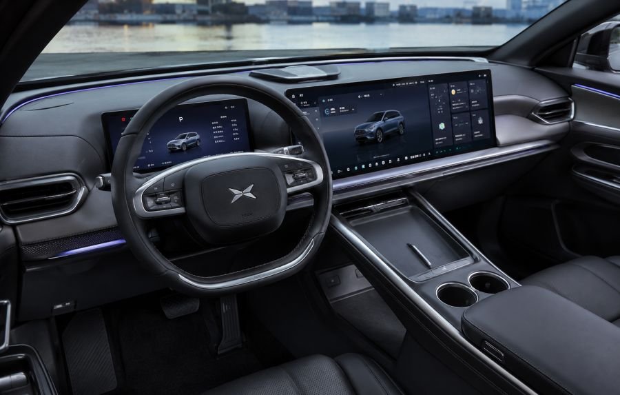 Interior cabin view of modern Chinese car showing technology features, steering wheel, dashboard, and advanced infotainment system