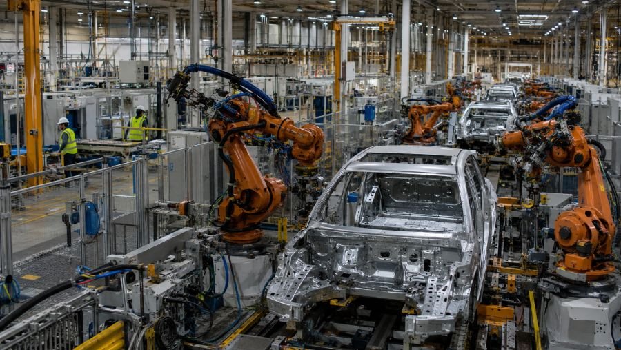 Interior of a modern EV assembly plant in Mexico with robotic production lines