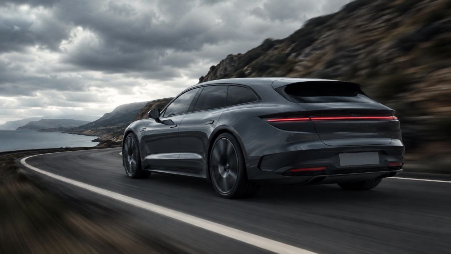 Premium Chinese electric shooting-brake driving on a coastal mountain road