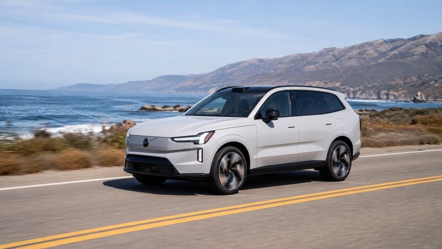 Volvo EX90 electric SUV driving on an American highway in 2026