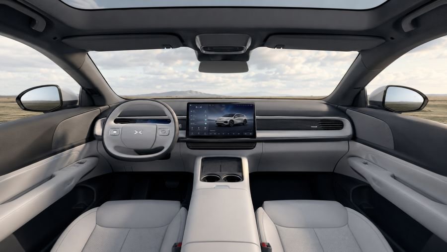 XPeng G6 minimalist interior with large central touchscreen and panoramic roof